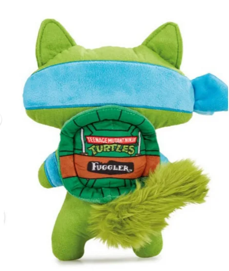 Green plush toy with blue headband and 'Fuggler' branding on a white background
