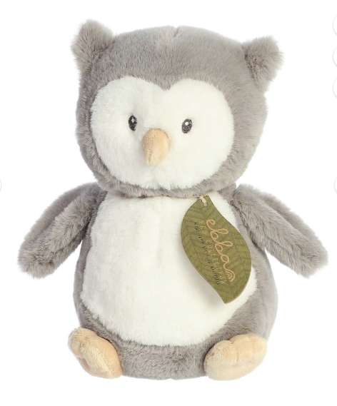 Plush owl toy with a green leaf tag on a white background