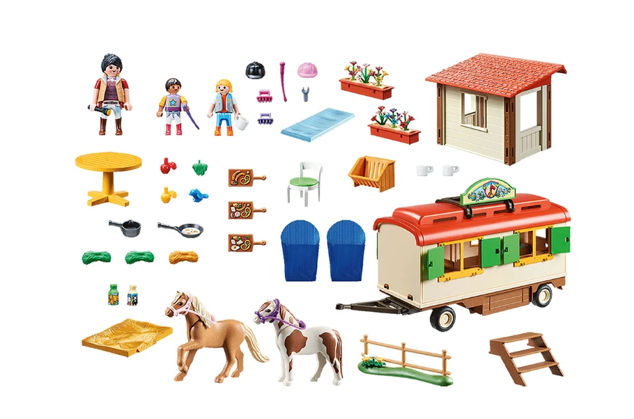 Set of toy figures, furniture, and animals on a white background