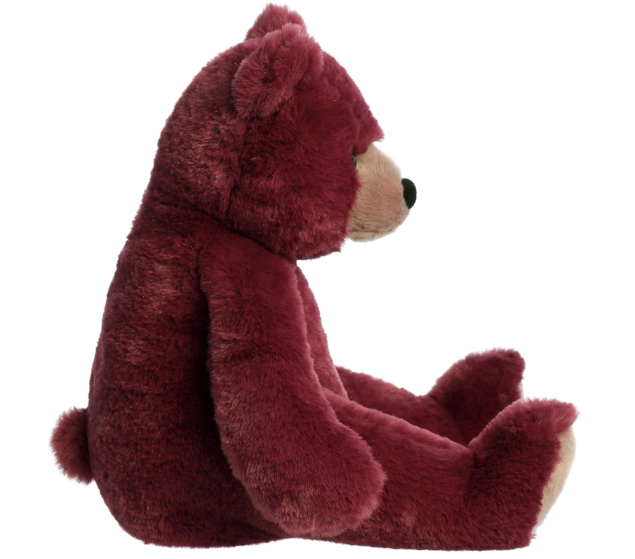 Plush teddy bear in red on a white background
