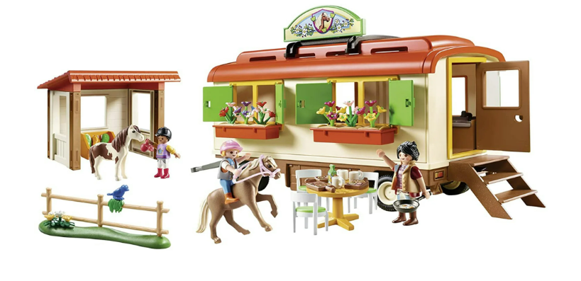Toy playset with a camper, horses, and people on a white background